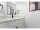 Modern bathroom with a white vanity and black fixtures at 3491 N Arizona Ave # 98, Chandler, AZ 85225