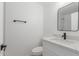 Modern bathroom with white vanity, quartz countertop, and black fixtures at 3491 N Arizona Ave # 98, Chandler, AZ 85225