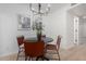 Small dining area with a black table and four red leather chairs at 3491 N Arizona Ave # 98, Chandler, AZ 85225