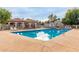 Community pool with covered seating and lounge chairs at 3491 N Arizona Ave # 98, Chandler, AZ 85225