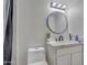 Modern bathroom with a large vanity and a round mirror at 355 E Thomas Rd # B206, Phoenix, AZ 85012