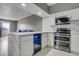 Modern kitchen with wine cooler and stainless steel appliances at 355 E Thomas Rd # B206, Phoenix, AZ 85012