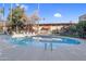 Inviting community pool with lounge chairs at 355 E Thomas Rd # B206, Phoenix, AZ 85012