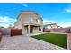 Home features a grassy backyard with a patio and artificial turf at 3702 W Naomi Ln, San Tan Valley, AZ 85144