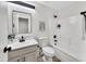 Updated bathroom with gray vanity and white tile at 3702 W Naomi Ln, San Tan Valley, AZ 85144