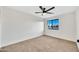 Bright bedroom with window and ceiling fan at 3702 W Naomi Ln, San Tan Valley, AZ 85144