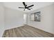 Bright bedroom with ceiling fan and wood-look floors at 3702 W Naomi Ln, San Tan Valley, AZ 85144