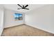 Simple bedroom with a window and carpet flooring at 3702 W Naomi Ln, San Tan Valley, AZ 85144