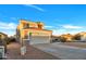 Two-story house with a two-car garage and desert landscaping at 3702 W Naomi Ln, San Tan Valley, AZ 85144