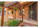 Relaxing backyard patio with pergola and potted plants at 3923 E Kesler Ln, Gilbert, AZ 85295