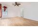 Bright bedroom with ceiling fan and wood-look flooring at 3923 E Kesler Ln, Gilbert, AZ 85295