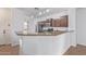 Kitchen with granite countertops and dark brown cabinets at 3923 E Kesler Ln, Gilbert, AZ 85295