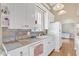 White kitchen with tile countertops and wood flooring at 3955 W Cindy St, Chandler, AZ 85226