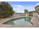 Beautiful backyard swimming pool with a patio and covered outdoor seating area, perfect for entertaining at 4059 E Cholla St, Phoenix, AZ 85028