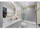 Modern bathroom with gold accents, sleek vanity, and a glass-enclosed shower/tub combination at 4059 E Cholla St, Phoenix, AZ 85028