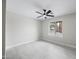 Clean, bright bedroom featuring a large window and ceiling fan at 4059 E Cholla St, Phoenix, AZ 85028