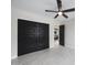 Bedroom with modern sliding closet doors and access to another room with stylish decor at 4059 E Cholla St, Phoenix, AZ 85028