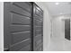 Hallway featuring shaker doors, leading to various rooms, showcasing the home's modern design at 4059 E Cholla St, Phoenix, AZ 85028