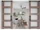 Home office featuring sliding barn doors, a desk, and a comfortable chair at 4059 E Cholla St, Phoenix, AZ 85028