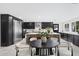 Modern kitchen with stainless steel appliances, ample counter space, and an eat-in dining table at 4059 E Cholla St, Phoenix, AZ 85028