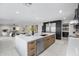 Modern kitchen featuring a large center island with light countertops and stainless steel appliances at 4059 E Cholla St, Phoenix, AZ 85028