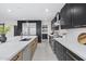 Spacious kitchen showcasing dark cabinetry, stainless steel appliances, and a large center island at 4059 E Cholla St, Phoenix, AZ 85028