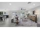 Bright and airy living room with modern furnishings, neutral tones, and access to the backyard at 4059 E Cholla St, Phoenix, AZ 85028