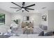 Bright living room featuring modern furnishings and a large ceiling fan at 4059 E Cholla St, Phoenix, AZ 85028