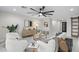 Stylish living room with neutral tones, modern furniture, and a unique ceiling fan at 4059 E Cholla St, Phoenix, AZ 85028