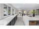 Bright living room with large windows and open floor plan adjacent to the modern kitchen at 4059 E Cholla St, Phoenix, AZ 85028