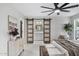 Spacious main bedroom with a view of the ensuite bathroom through glass-paneled sliding doors at 4059 E Cholla St, Phoenix, AZ 85028