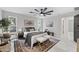 Bright main bedroom with a modern ceiling fan, large rug, and bedside tables at 4059 E Cholla St, Phoenix, AZ 85028