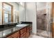 Bathroom with a vanity, granite countertop, and a shower at 4208 N Via Cobre Cir, Mesa, AZ 85207