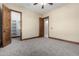 Bright bedroom featuring ample closet space and neutral carpeting at 4208 N Via Cobre Cir, Mesa, AZ 85207