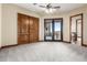 Secondary bedroom with French doors leading to patio at 4208 N Via Cobre Cir, Mesa, AZ 85207