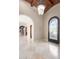 Grand entryway with arched doorways and a beautiful chandelier at 4208 N Via Cobre Cir, Mesa, AZ 85207