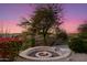 Relaxing fire pit area with landscaping and sunset views at 4208 N Via Cobre Cir, Mesa, AZ 85207