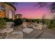 Landscaped patio with fire pit and stunning sunset views at 4208 N Via Cobre Cir, Mesa, AZ 85207