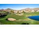 Picturesque golf course with houses and mountains in the background at 4208 N Via Cobre Cir, Mesa, AZ 85207