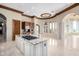 Open concept kitchen with large island and plenty of natural light at 4208 N Via Cobre Cir, Mesa, AZ 85207