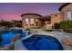 Luxury backyard oasis with pool, spa, and stone accents at 4208 N Via Cobre Cir, Mesa, AZ 85207