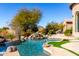 Relaxing pool and waterfall feature with mountain views at 4208 N Via Cobre Cir, Mesa, AZ 85207