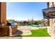 Outdoor oasis with a large pool, built-in grill, and mountain views at 4208 N Via Cobre Cir, Mesa, AZ 85207