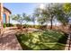 Landscaped backyard with private putting green at 4208 N Via Cobre Cir, Mesa, AZ 85207