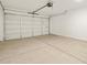 Spacious two-car garage with white door and concrete flooring at 4267 W Jeanette Ln, San Tan Valley, AZ 85144