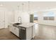 Kitchen island with stainless steel sink, faucet, and a dishwasher at 4267 W Jeanette Ln, San Tan Valley, AZ 85144