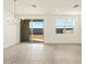 Living room with sliding glass doors to backyard and white walls at 4267 W Jeanette Ln, San Tan Valley, AZ 85144