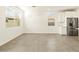 Bright living area with stainless steel refrigerator and white cabinets at 4267 W Jeanette Ln, San Tan Valley, AZ 85144