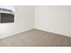 Neutral bedroom with a window, providing ample natural light and carpet at 4287 W Jeanette Ln, San Tan Valley, AZ 85144