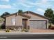 Single-story home with gray garage door and stone accents at 4287 W Jeanette Ln, San Tan Valley, AZ 85144